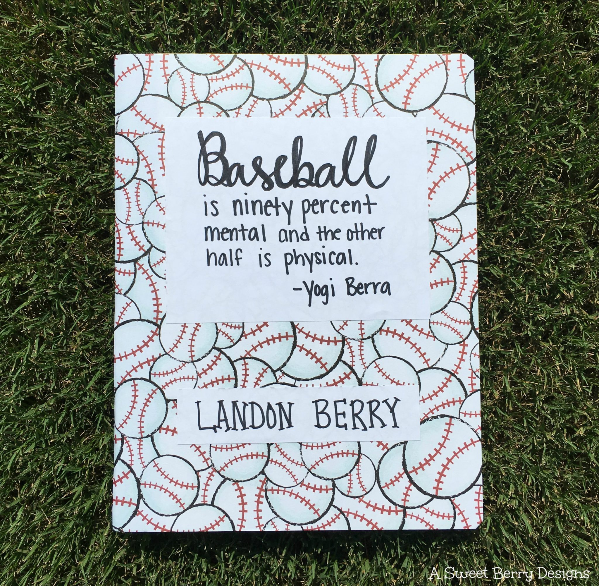notebook decorated with baseballs and handwritten quote