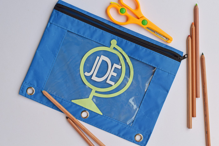 top shot of monogrammed blue pencil case