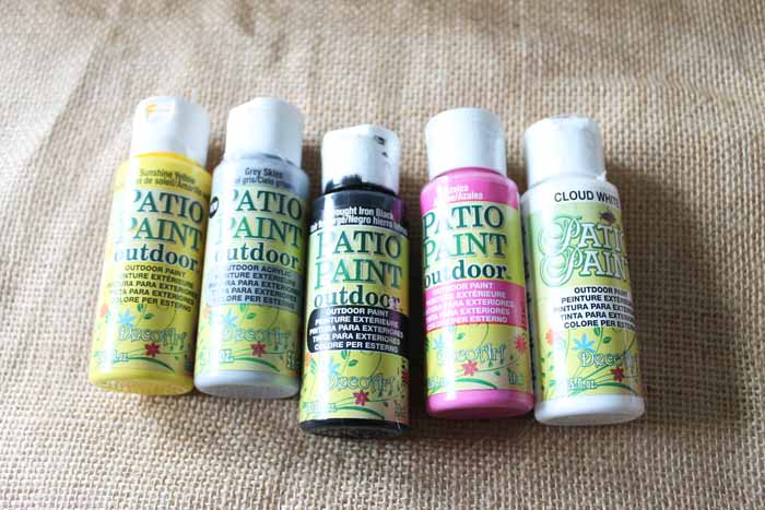 patio paint bottles of various colors on burlap