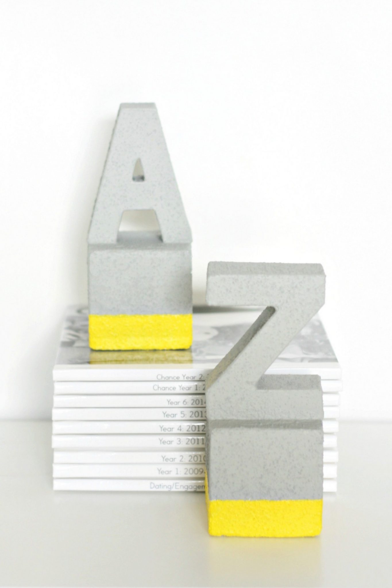 a and z concrete bookends with books. 
