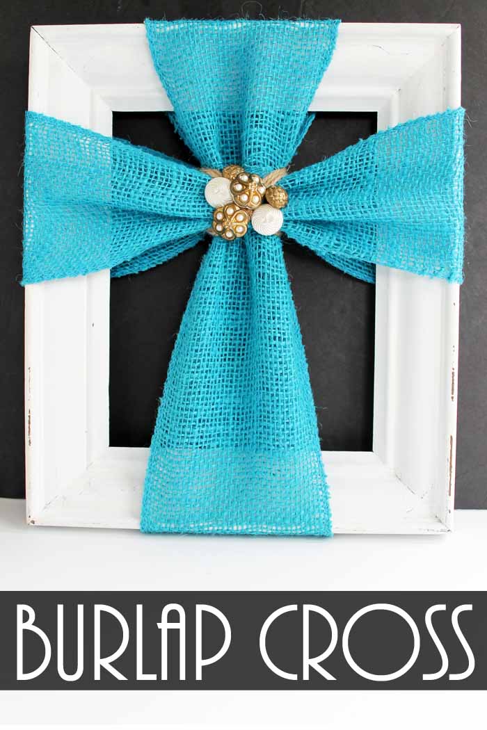 Pinnable image of white frame with blue burlap cross with golden brooch in the center with text overlay saying "burlap cross
