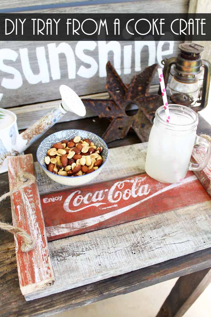 A diy vintage tray of food on a table, with nuts and a mason jar of milk with a striped straw