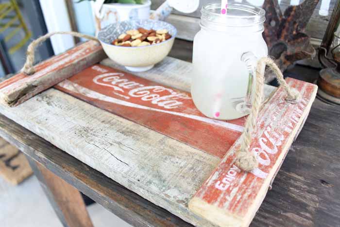 mason jar of milk and nuts on a diy coca cola tray