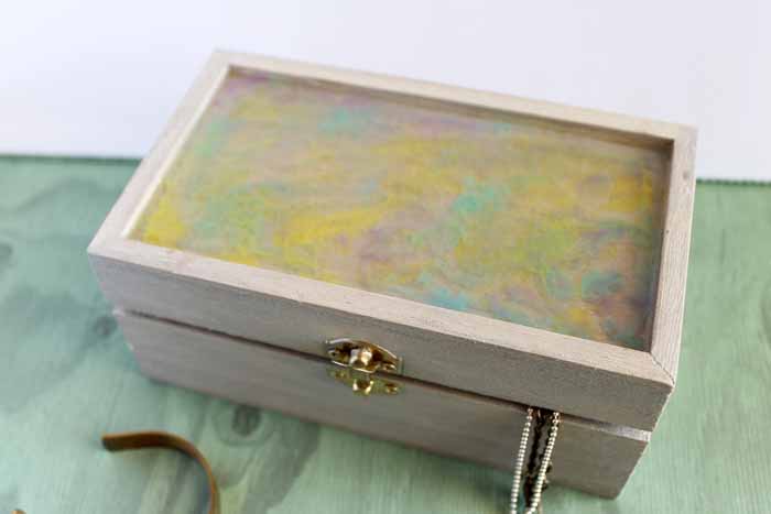 painted resin jewelry box with gold latch