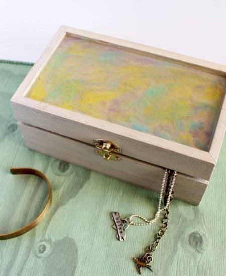 diy jewelry box on green wood