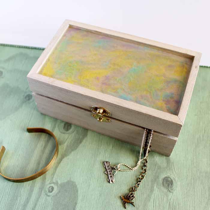 diy jewelry box on green wood