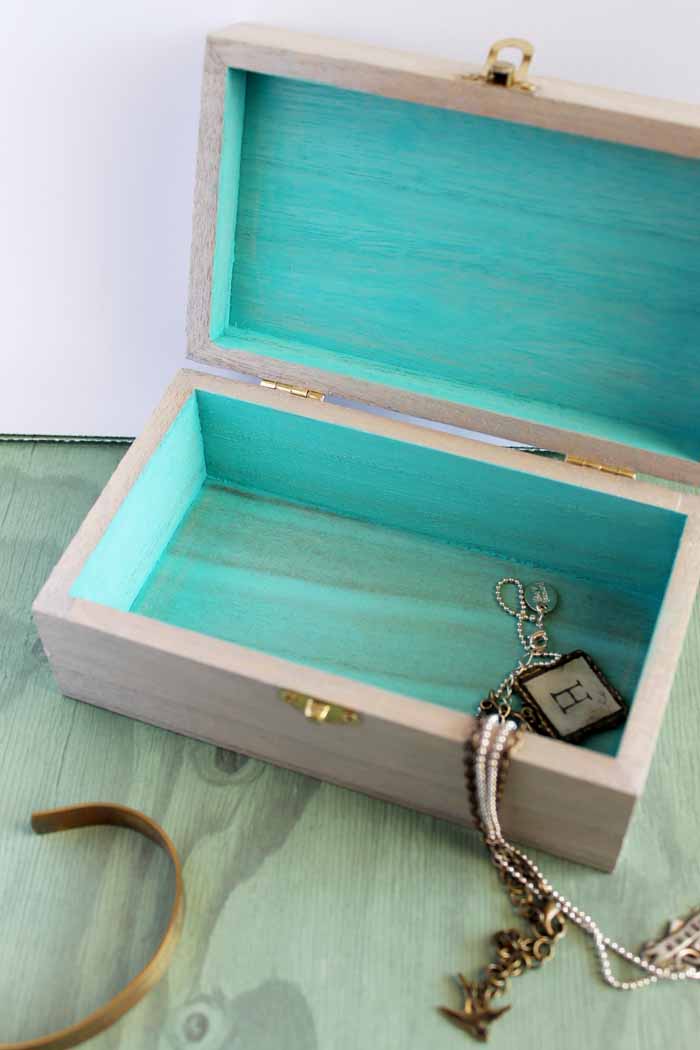 open jewelry box with turquoise interior