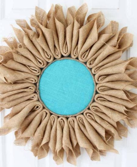 Learn how to make burlap flowers! A simple project that will look great as a wreath or in your home decor!