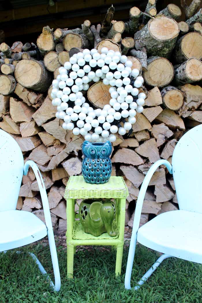 outdoor wreath hanging on lumber stack