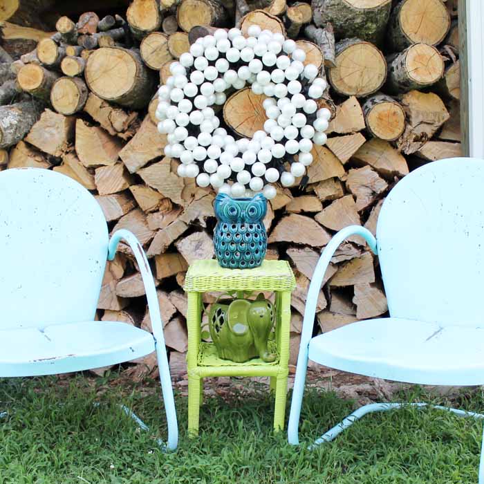 patio wreath with chairs and outdoor decor