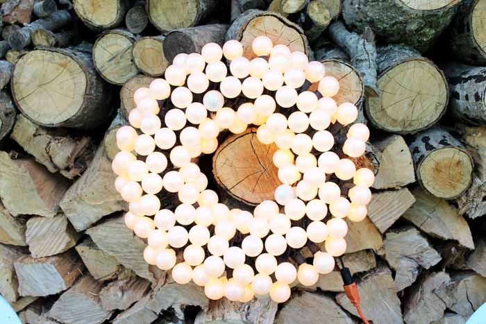 patio wreath with lit string lights