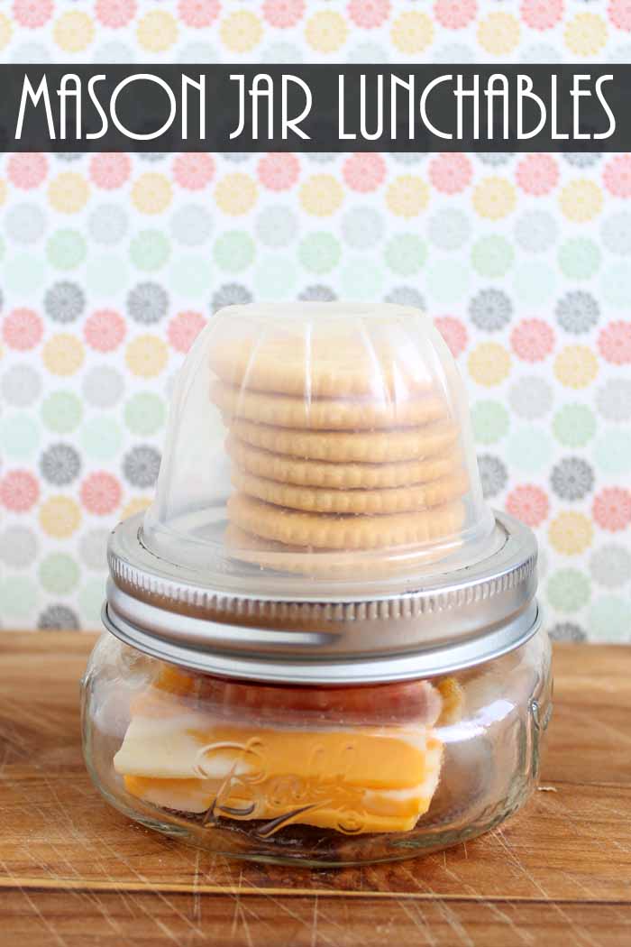mason jar lunchables on wooden table with text overlay