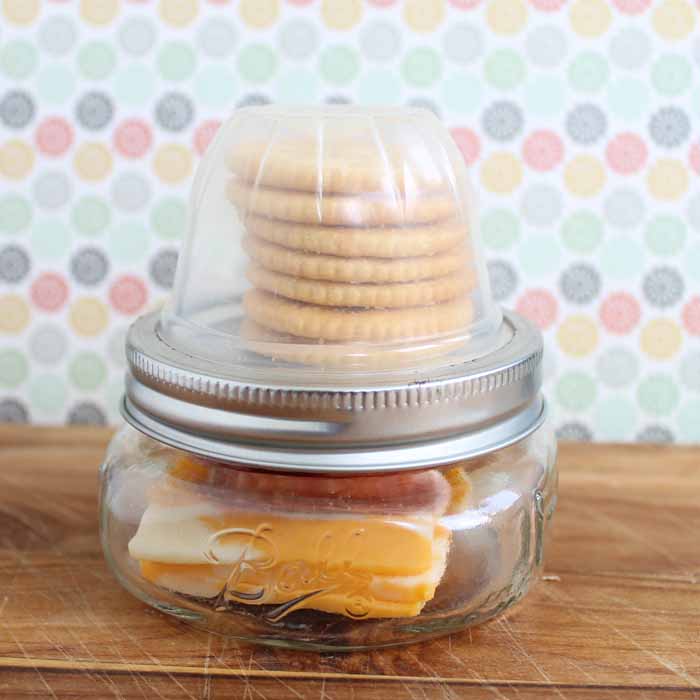 mason jar lunchables on wooden table