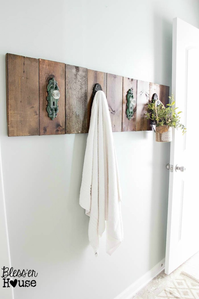 I love this rustic bathroom towel holder made from vintage door handles.