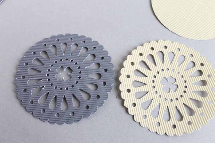 A close up of the cuts on corrugated cardboard when comparing the Cricut Maker and Explore