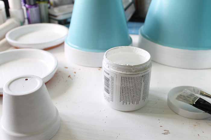 Flower pots painted white and blue