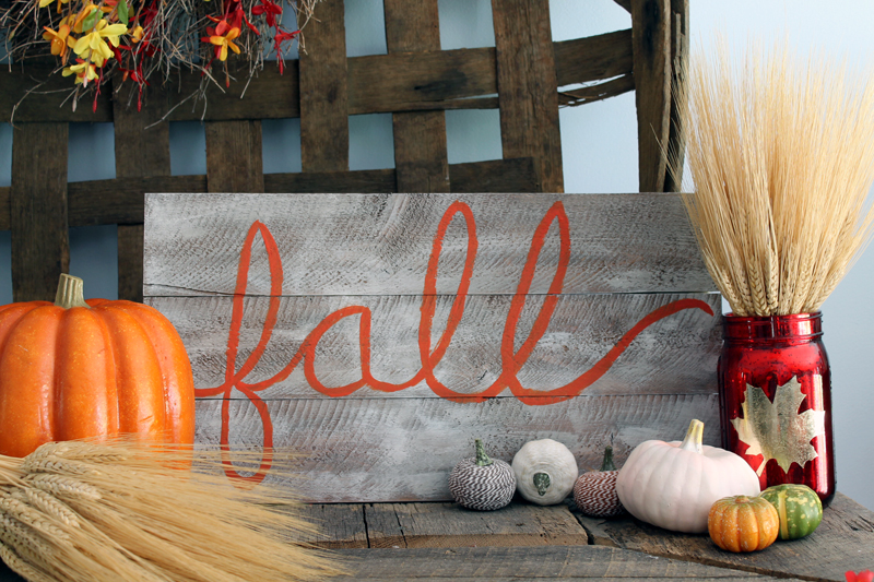 complete DIY barnwood sign among other fall decor