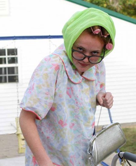 A person wearing and old lady halloween costume