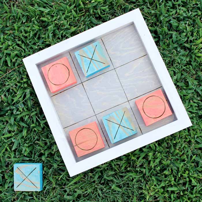 Use the wood burning tool to create the tic tac toe game board