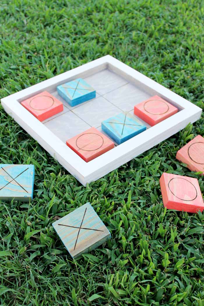 This outdoor game board has two sides, one for tic tac toe and one for checkers!