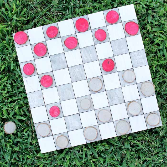 Make this reversible outdoor yard game board with a tic tac toe board and checkers board