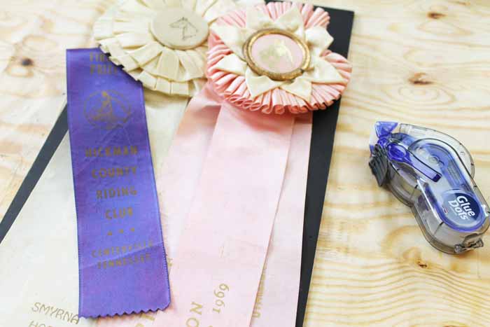 Pink, white and purple ribbons on wood