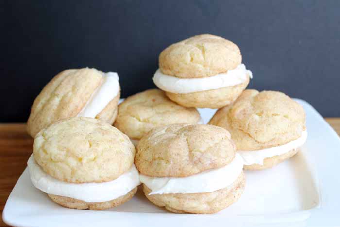 Snickerdoodle whoopie pies on a white plate 