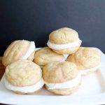 Snickerdoodle whoopie pies on a white plate