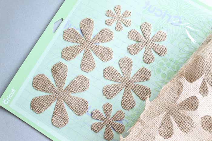burlap flower pieces on Cricut cutting mat