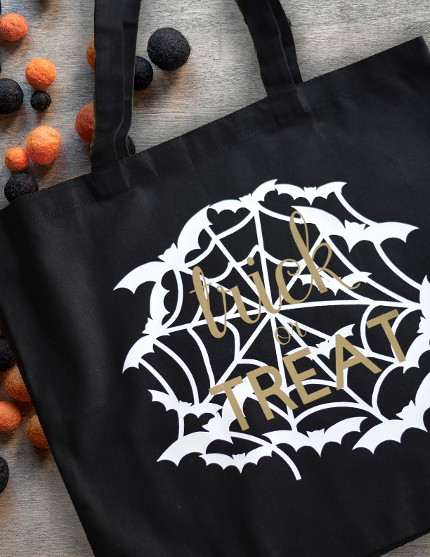 black treat bag with white vinyl spider web