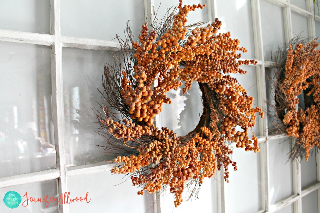 orange berry wreath on window