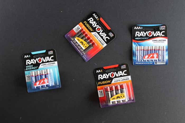 packages of Rayovac batteries on a black backdrop