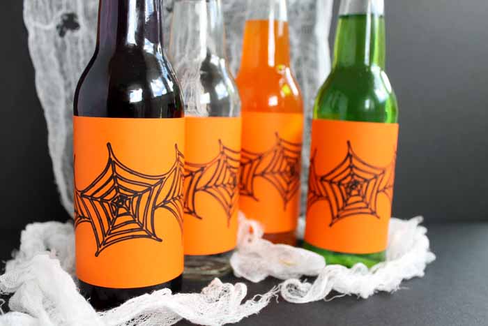 close up of assorted drinks with Halloween bottle labels on gauze