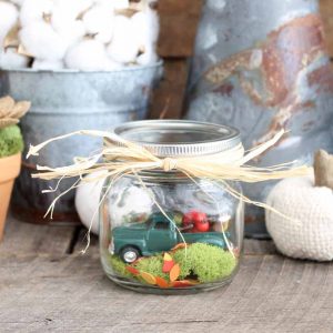 mason jar in front of fall backdrop