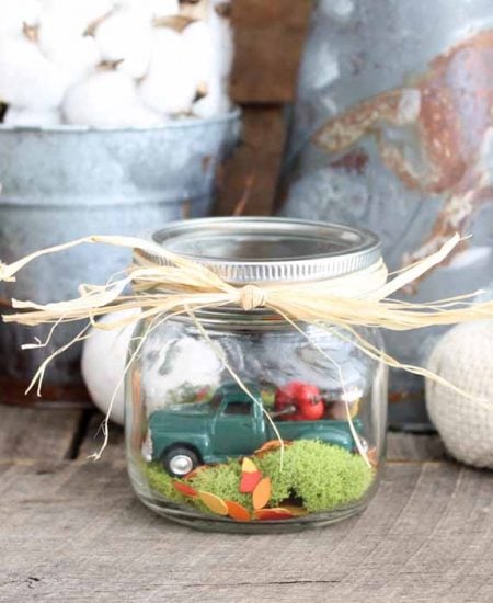 mason jar in front of fall backdrop