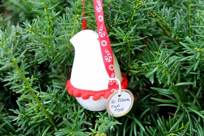 ornament of a bird hanging on a Christmas tree