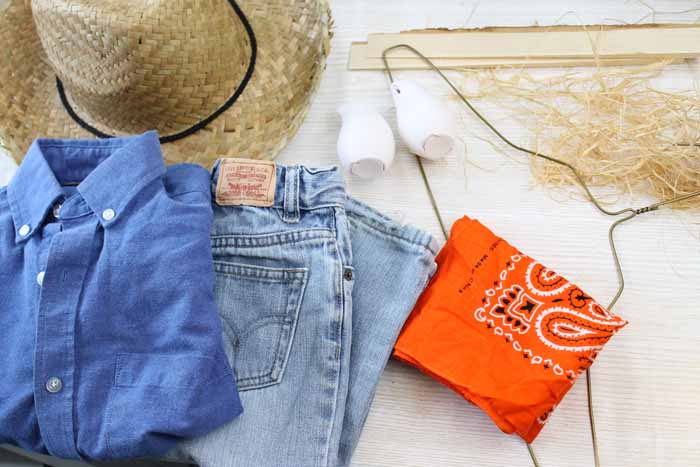 supplies to make a scarecrow wreath with jeans denim shirt straw hat and orange bandana