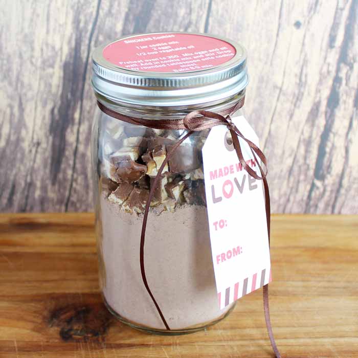 Mason Jar Cookie Mix gift on a wooden backdrop