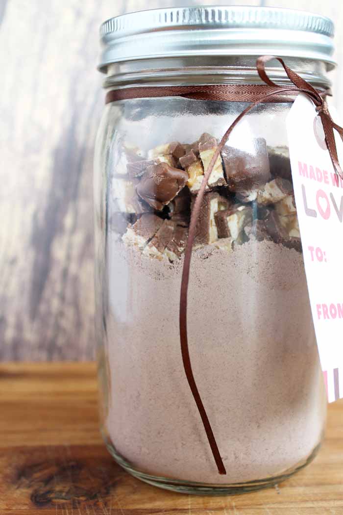 jar mix of snicker cookies on a wooden cutting board