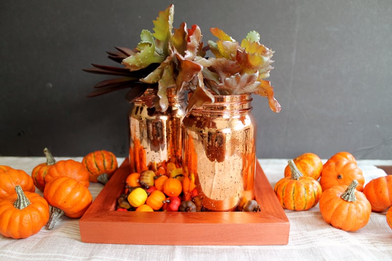 mason jars in orange tray with pumpkins