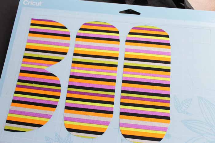 striped fabric boo letters on a cutting mat