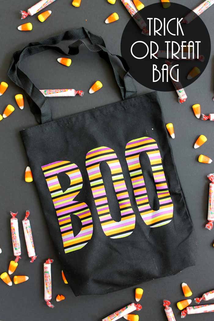 Close up of black boo trick or treat bag on a black background