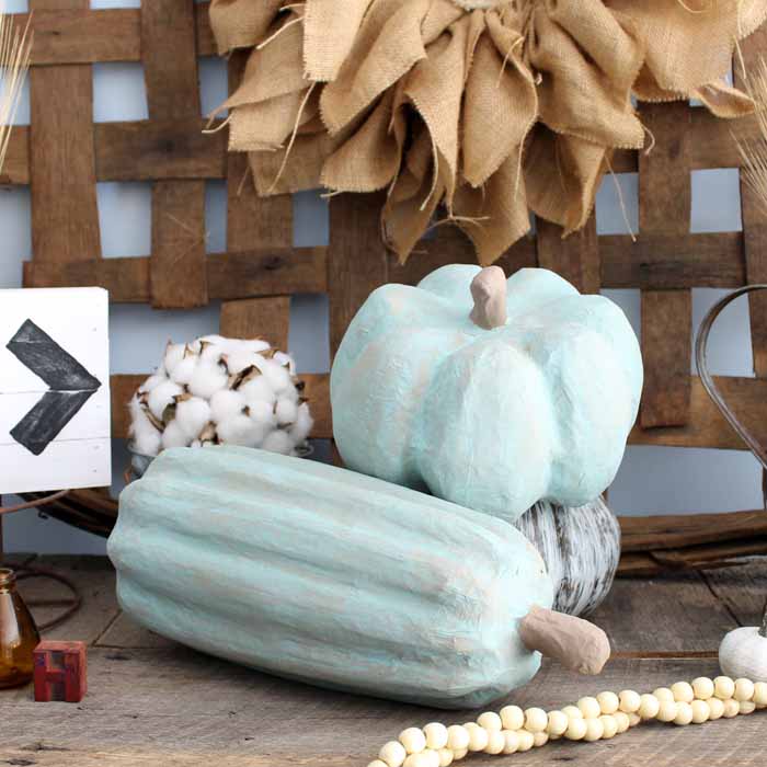 close up of diy painted pumpkins in a fall display