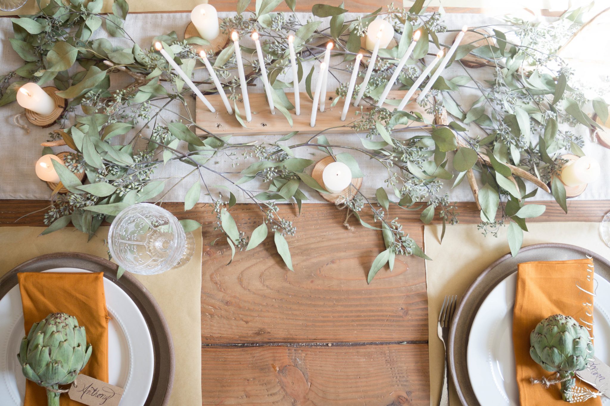 greenery on a table set for thanksgiving