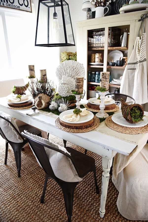 thanksgiving table with turkeys in the center