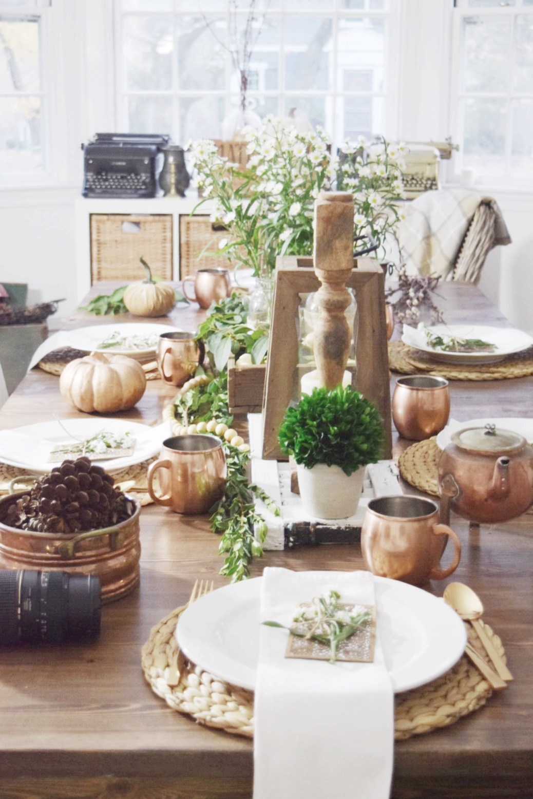 copper and wood accents on a fall table