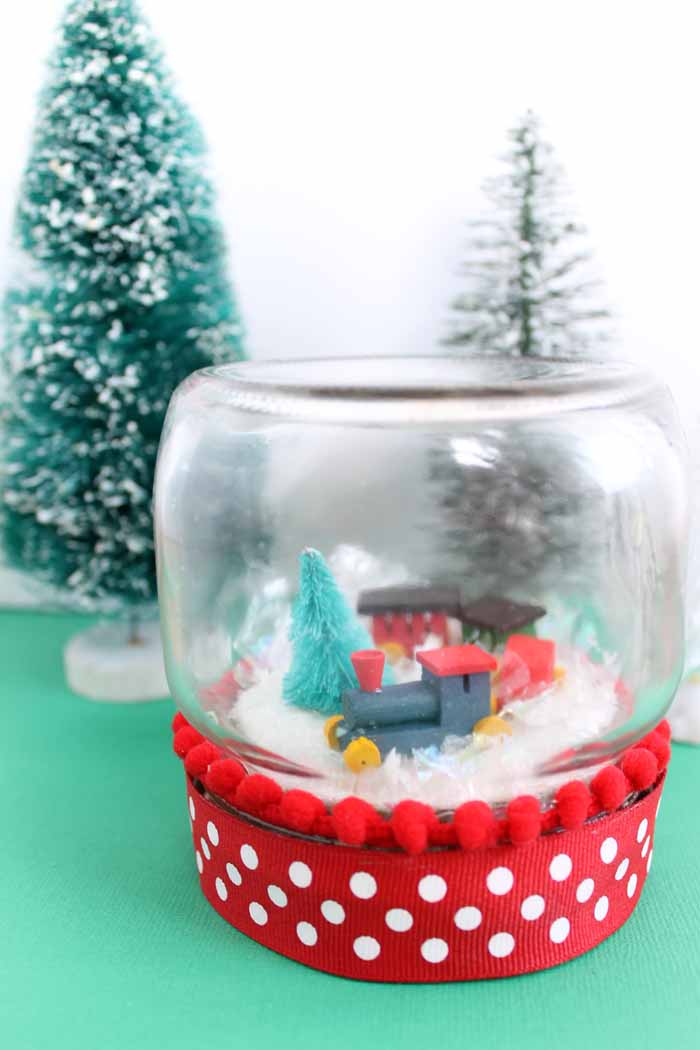 completed train snow globe for Christmas using a mason jar