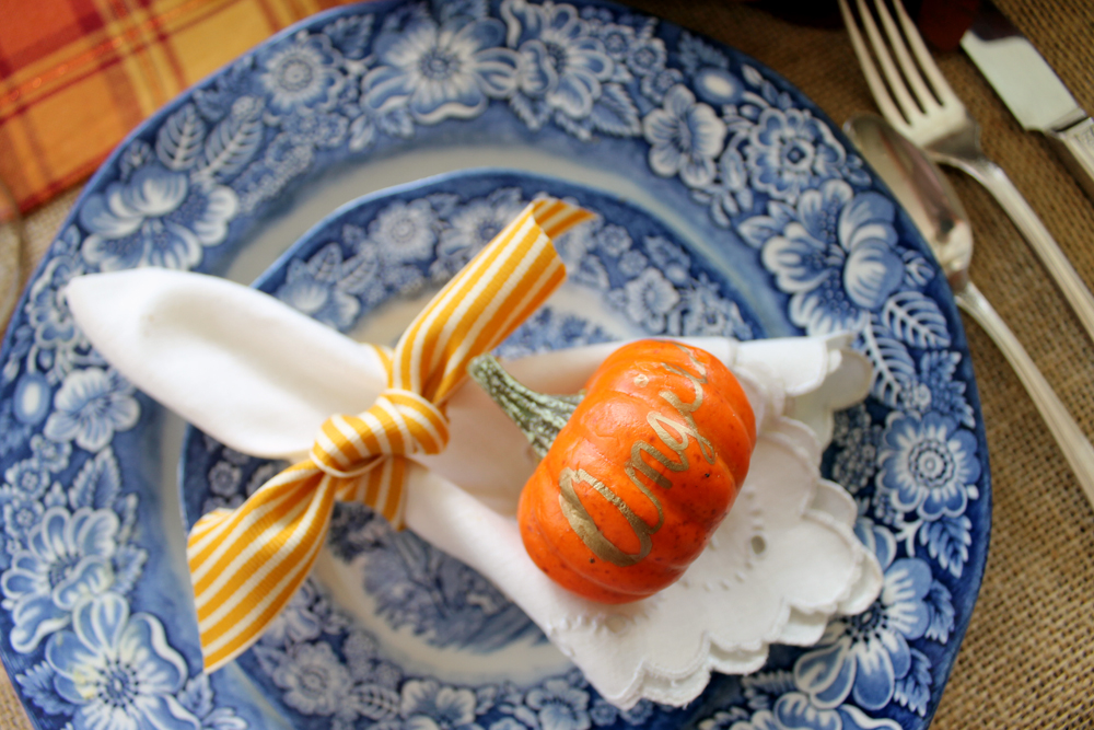 These Thanksgiving place settings are simply made with some ribbon and a customized mini pumpkin