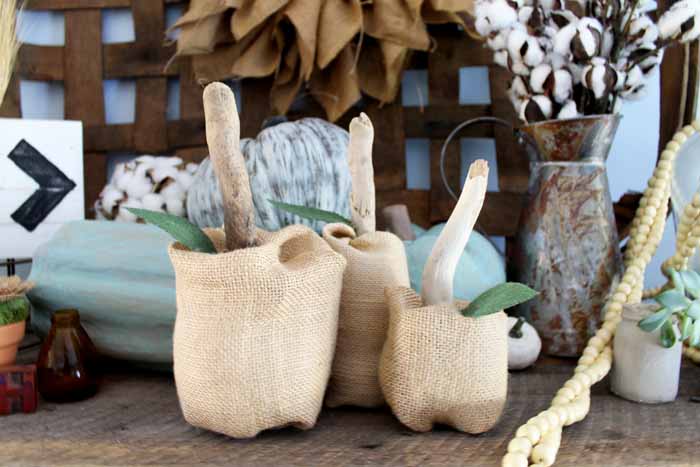 burlap pumpkins on a table