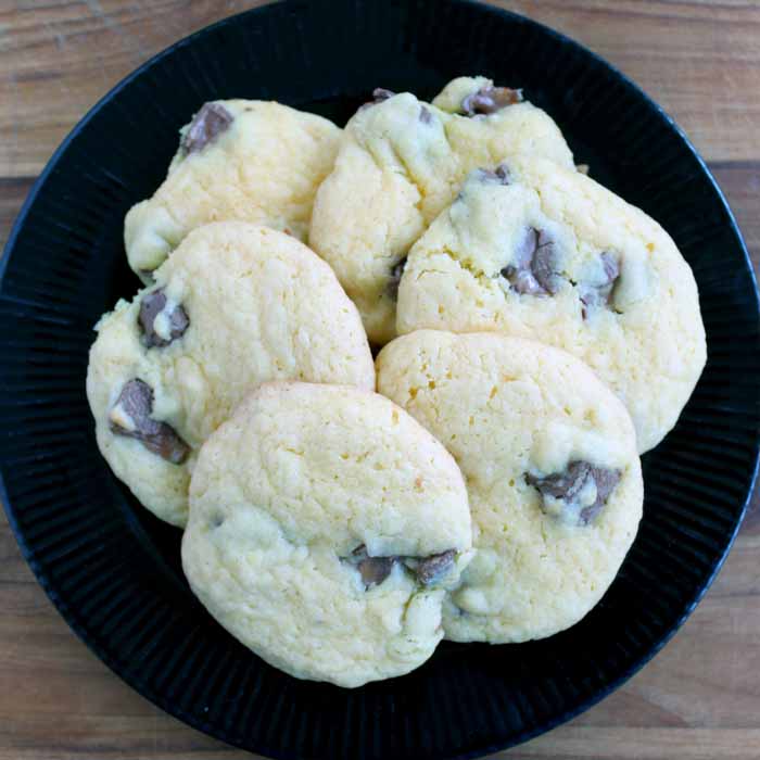 Black plate topped with cake mix cookies